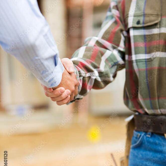 Supervisor building teamwork partnership gesture and people concept handshake on construction site